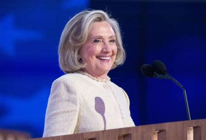 Hillary Clinton smiles attending public event 2015