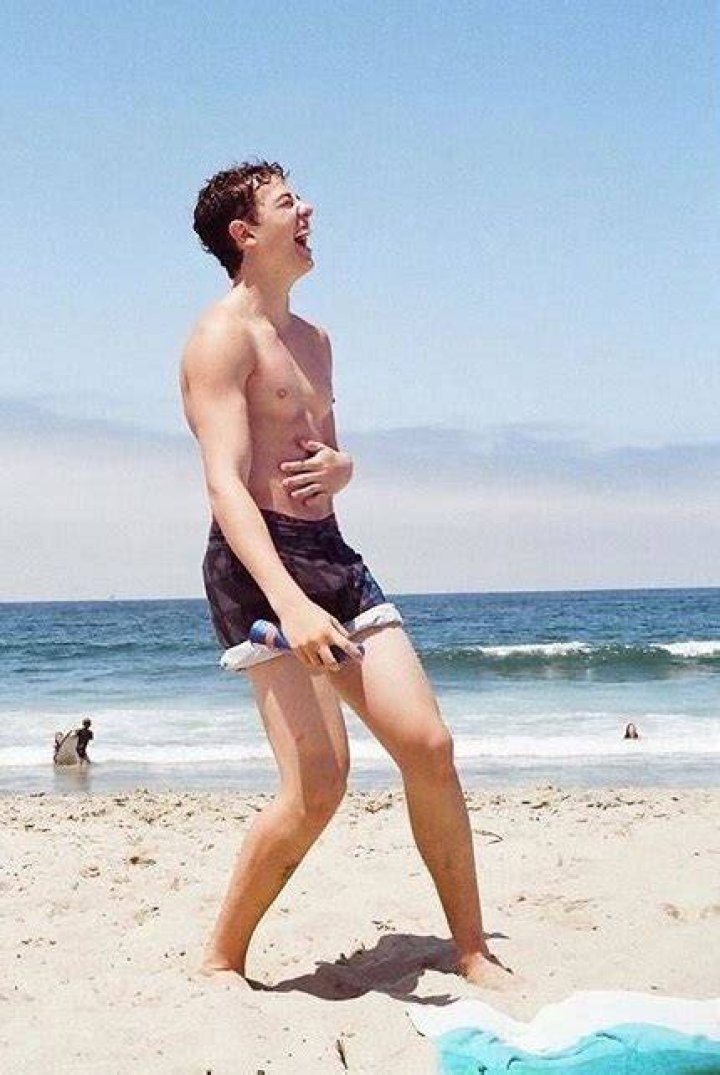 Israel Broussard shirtless during an outdoor selfie in October 2016