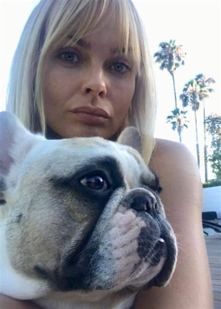 Izabella Scorupco with her dog as seen in July 2018