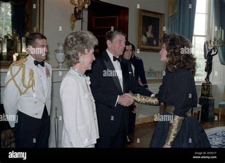 Jaclyn Smith greeting President Ronald Reagan and First Lady Nancy Reagan at a Reception for Major Contributors and Entertainers for The 1986 Ford'S Theater Festival Gala in The Blue Room in June 1986