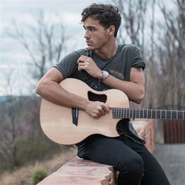 Jacob Whitesides playing guitar