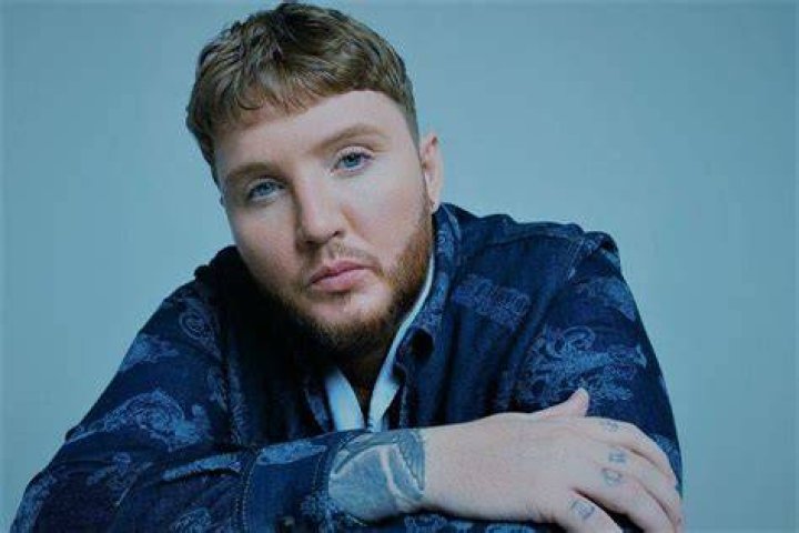 James Arthur wearing a blue silk shirt in a August 2017 selfie