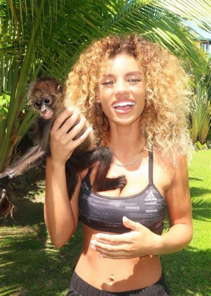 Jena Frumes posing in front of a Christmas tree in December 2018