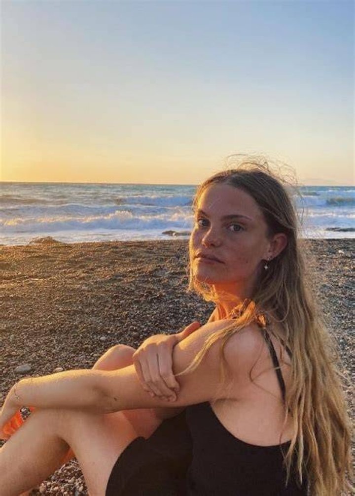 Jenny Richardson posing for a picture while enjoying her time at a beach during a vacation
