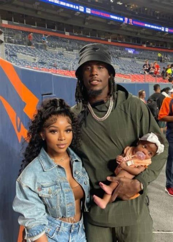 Jerry Jeudy, posing with Antoinette Tharp and their daughter, in October 2022