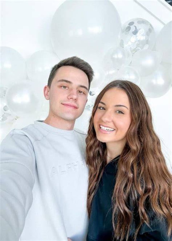 Jessica Baio and her beau Sam Jose in a picture with their new car that was taken in January 2023