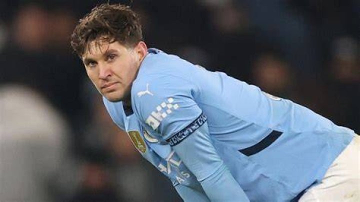 John Stones (sitting at the center) with his English teammates in June 2018