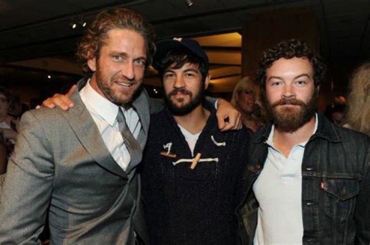 Jordan Masterson (center) with his brother Danny Masterson and Gerard Butler (Left) at the Machine Gun Preacher premiere in September 2011