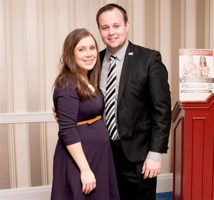 Josh Duggar with wife Anna and their fourth child, a daughter in a picture taken at their home in July 2015