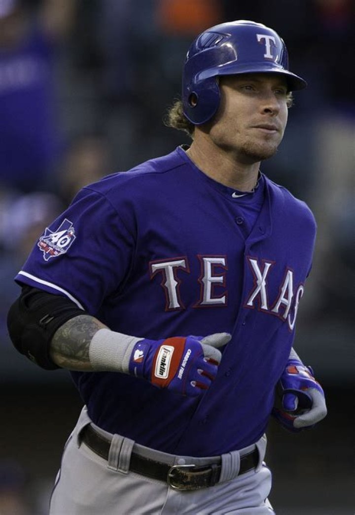 Josh Hamilton posing with a puppy