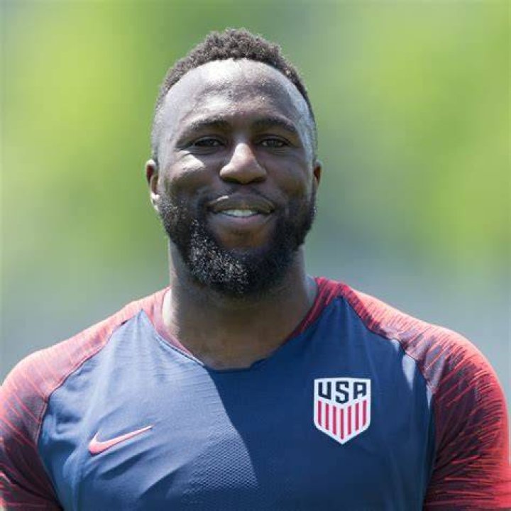 Jozy Altidore as seen in a picture taken while holding a custom 2014 World Cup dog tag that was presented to him at during an open-practice for fans at Everbank Stadium in June 2014