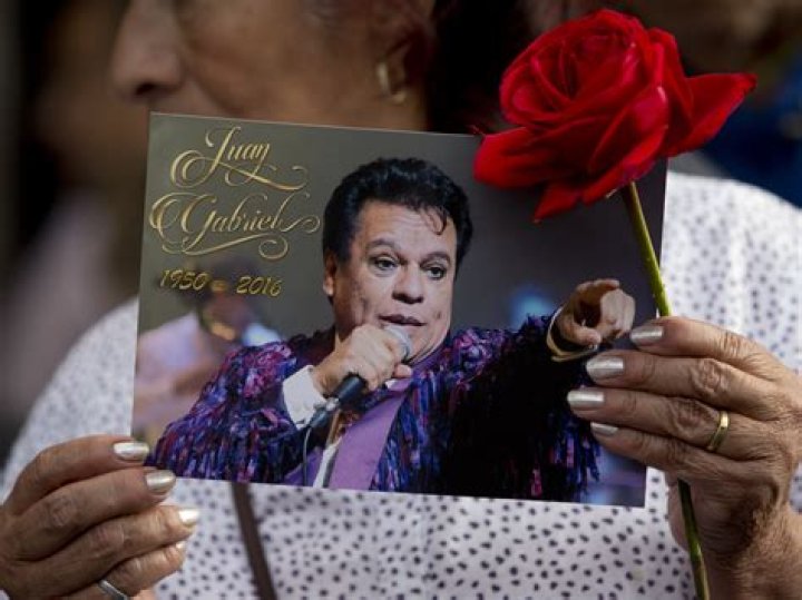 Juan seen with his wife and daughter in November 2019