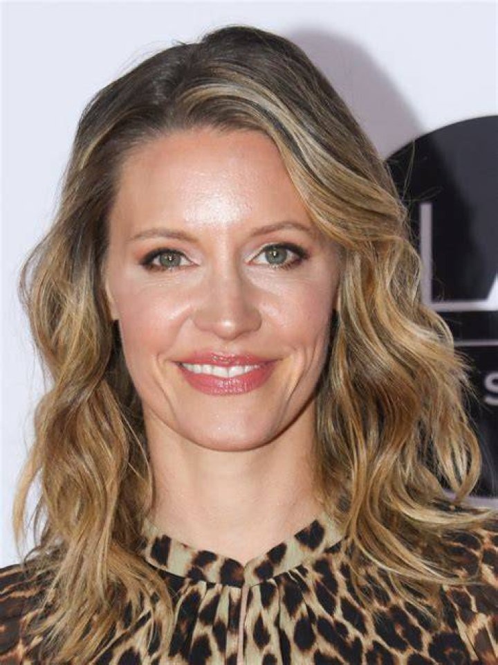 KaDee Strickland smiling in a selfie with Jason Behr and their son in July 2021