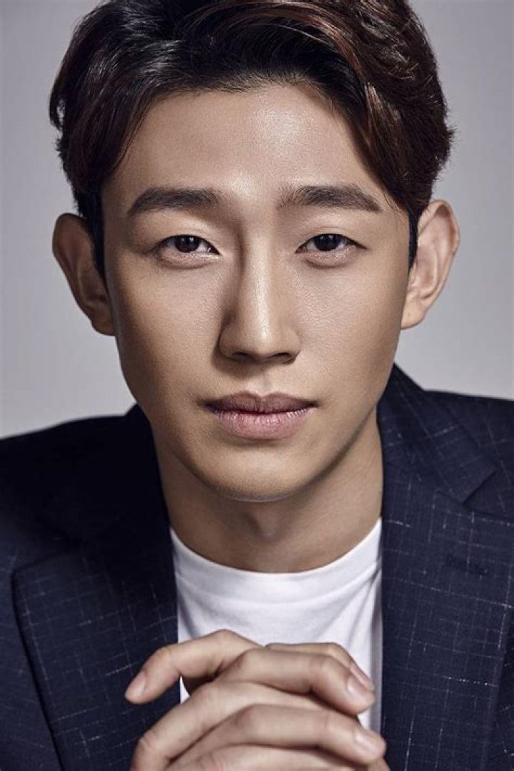 Kang Ki-young as seen while smiling for the camera during an event