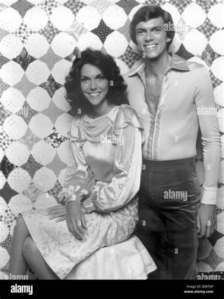 Karen Carpenter and Richard Carpenter as seen while smiling for a picture circa 1974