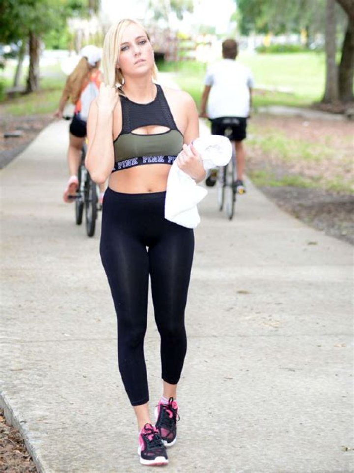 Kate England exercises in tights and sports bra in June 2016