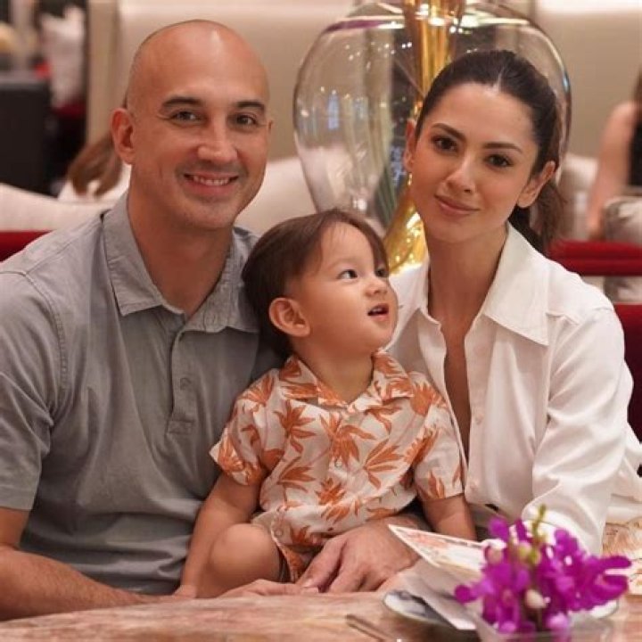 KC Montero smiling in a picture with his family at Grand Hyatt Manila in June 2022