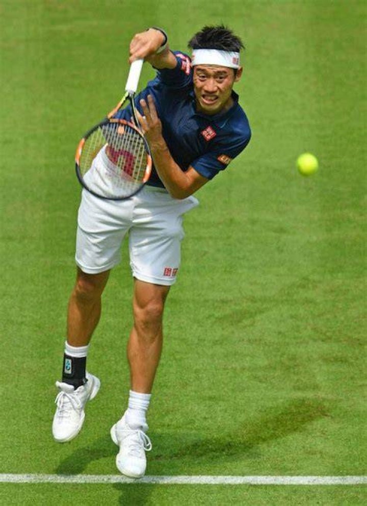 Kei Nishikori serves against Lucas Pouille in a match at Gerry Weber Open on June 13, 2016 in Halle, Germany