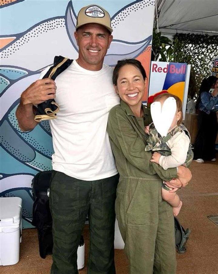 Kelly Slater with his girlfriend Kalani with their puppy as seen in July 2018