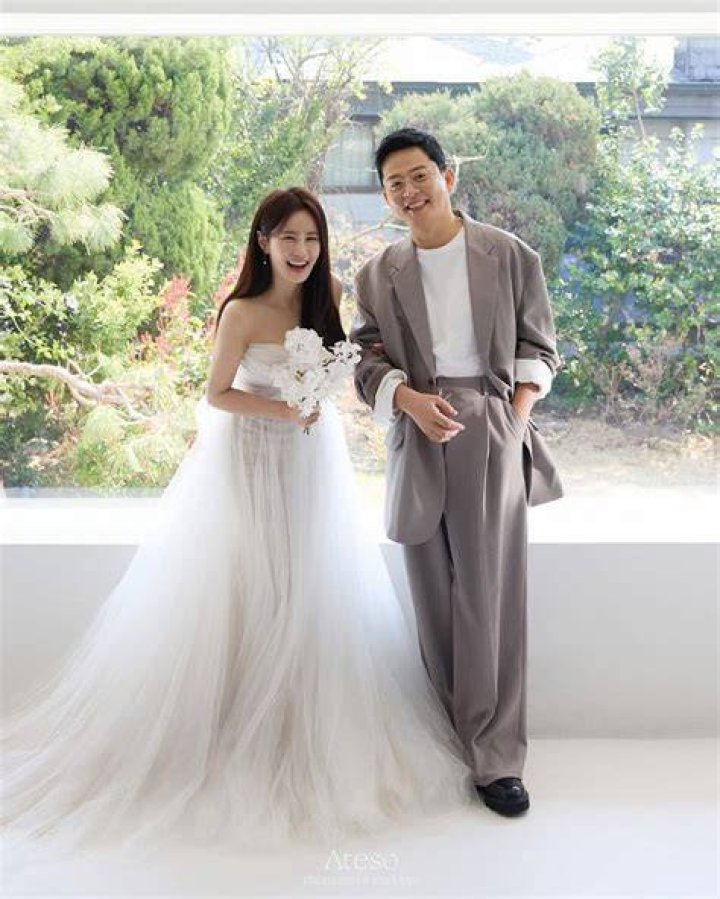 Kim Ji-min as seen while smiling for a picture in December 2020