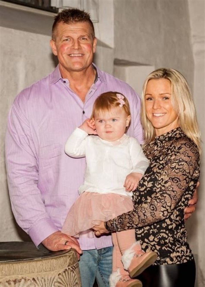 Kim Kold posing with his family
