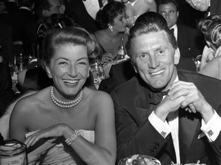 Kirk Douglas with wife Anne Buydens and former U.S. President Ronald Reagan (Right) at a private dinner at the Eldorado Country Club, California in December 1987