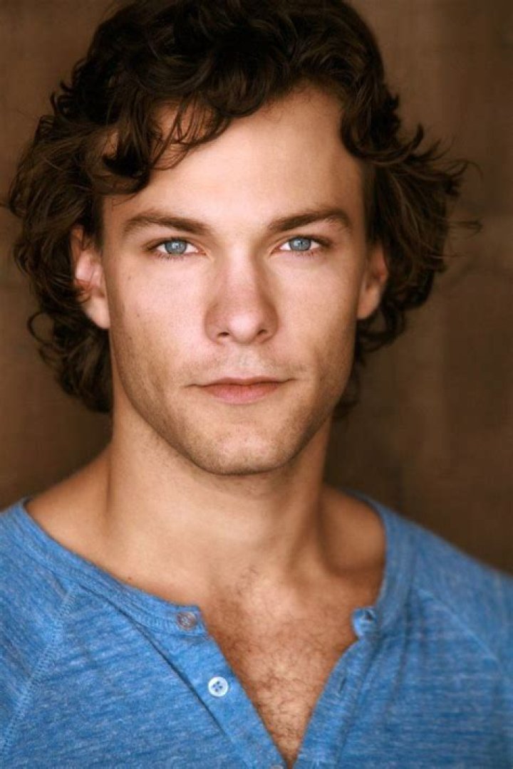 Kyle Schmid smiling for a picture with his grandmother in February 2021