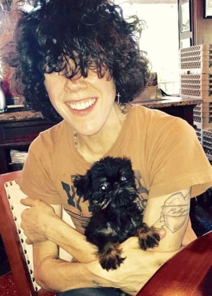 Laura Pergolizzi cuddling with her dog in Vienna, Austria in March 2017