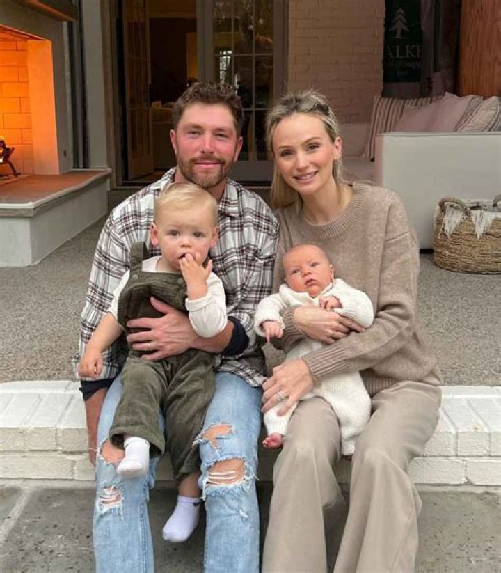 Lauren Bushnell and her husband attending a preparatory Baby 101 class with a model of a baby in May 2021