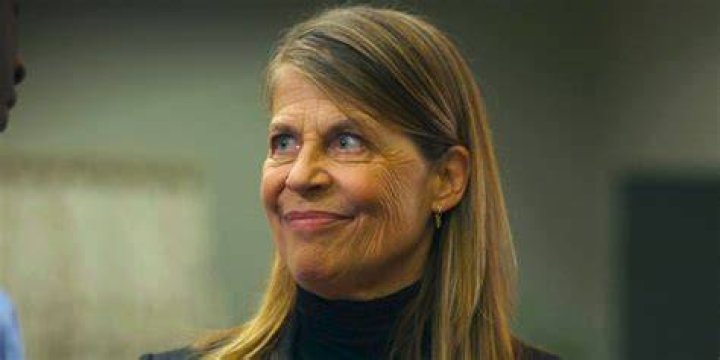 Linda Hamilton smiling in a picture alongside Marine Sgt. Raymond Lewis at the Marine Corps Birthday Ball on October 29, 2011, in Westlake, Texas, United States