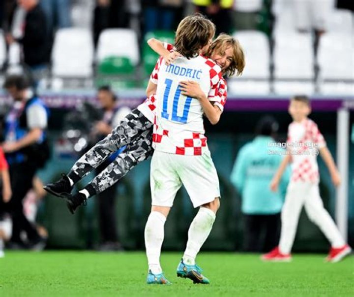 Luka Modric holds his son and poses with his wife Vanja Bosnic and his parents during Luka's presentation as a new Real Madrid player at Estadio Santiago Bernabeu on August 27, 2012 in Madrid, Spain