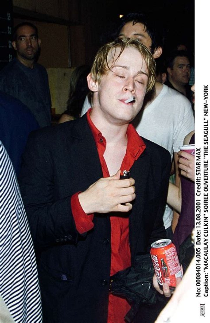 Macaulay Culkin enjoying a cigarette while roaming solo in New York City