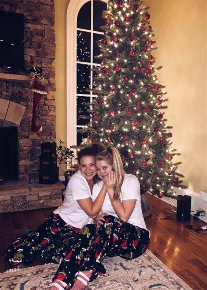 Madison Haschak (Left) as seen while posing for a Christmas picture along with Julia Reilly in December 2018