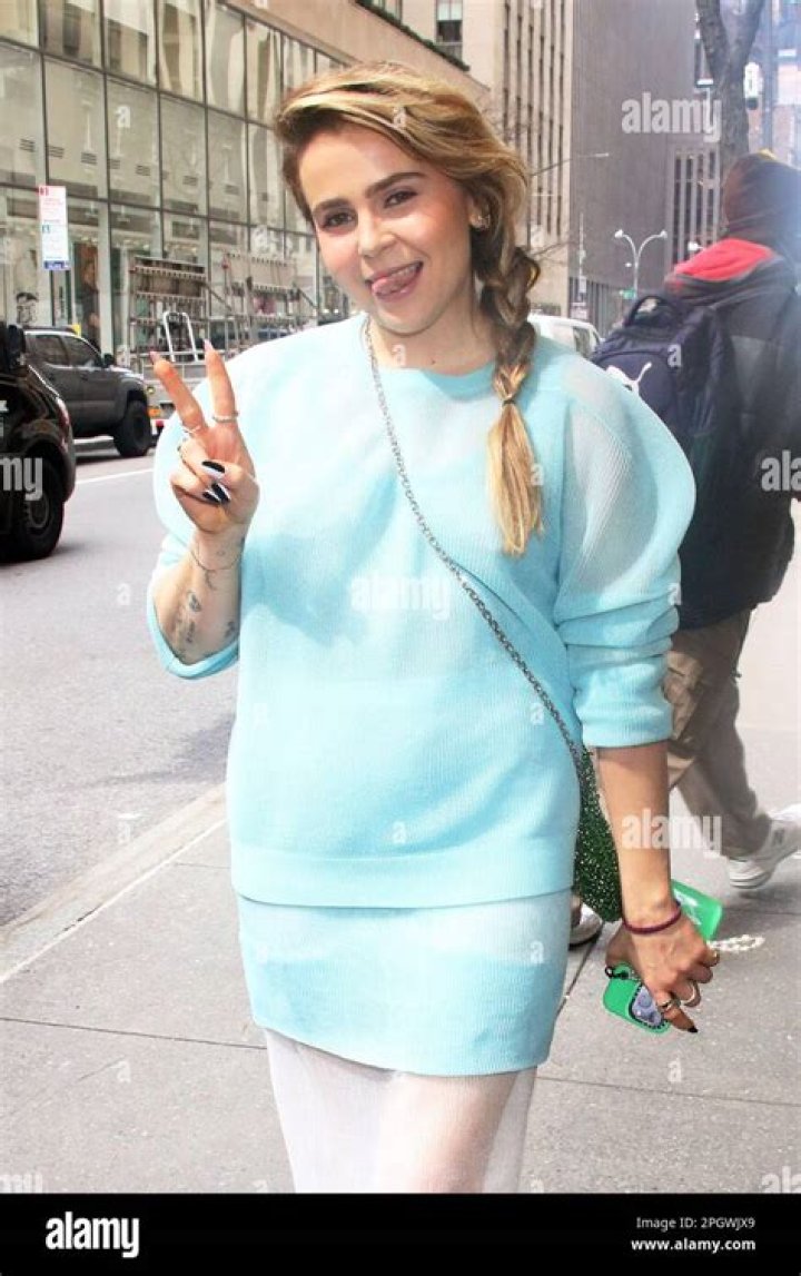 Mae Whitman as seen in a snake print dress in March 2018