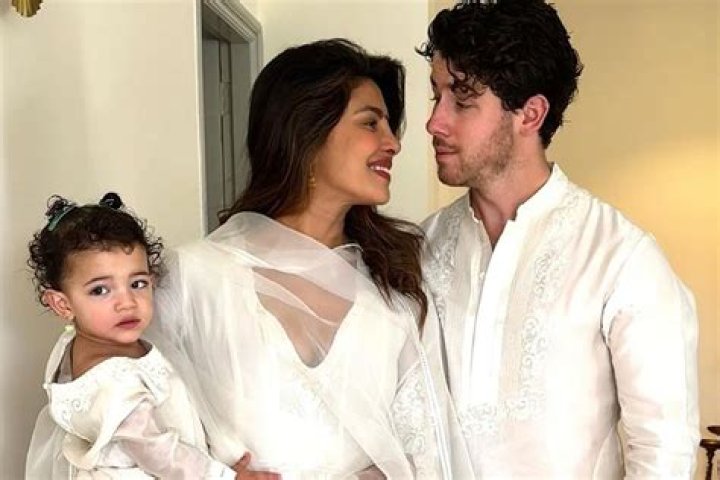 Malti Marie Chopra Jonas as seen in a picture with her mother Priyanka and father Nick Jonas in November 2022, in Los Angeles, California