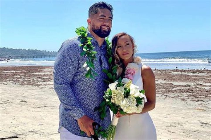 Manti Te'o as seen in a picture with his wife Jovi Nicole and their child in December 2022, in Lehi, Utah