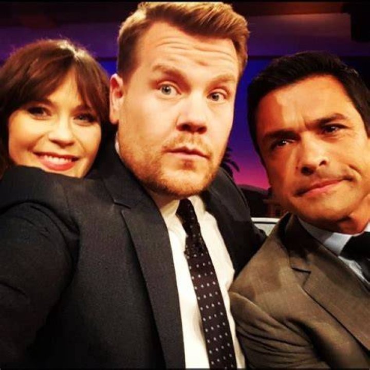 Mark Consuelos and Zooey Deschanel taking a selfie with James Corden on his talk show in November 2016