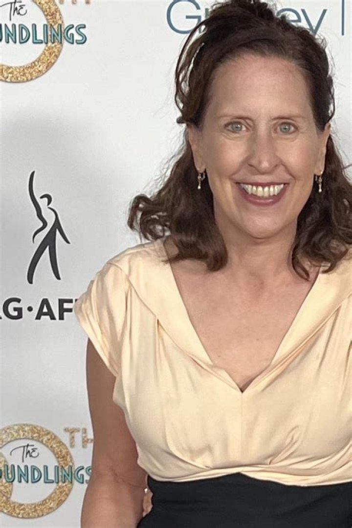 Mary Scheer as seen in a picture with two little puppies in April 2017