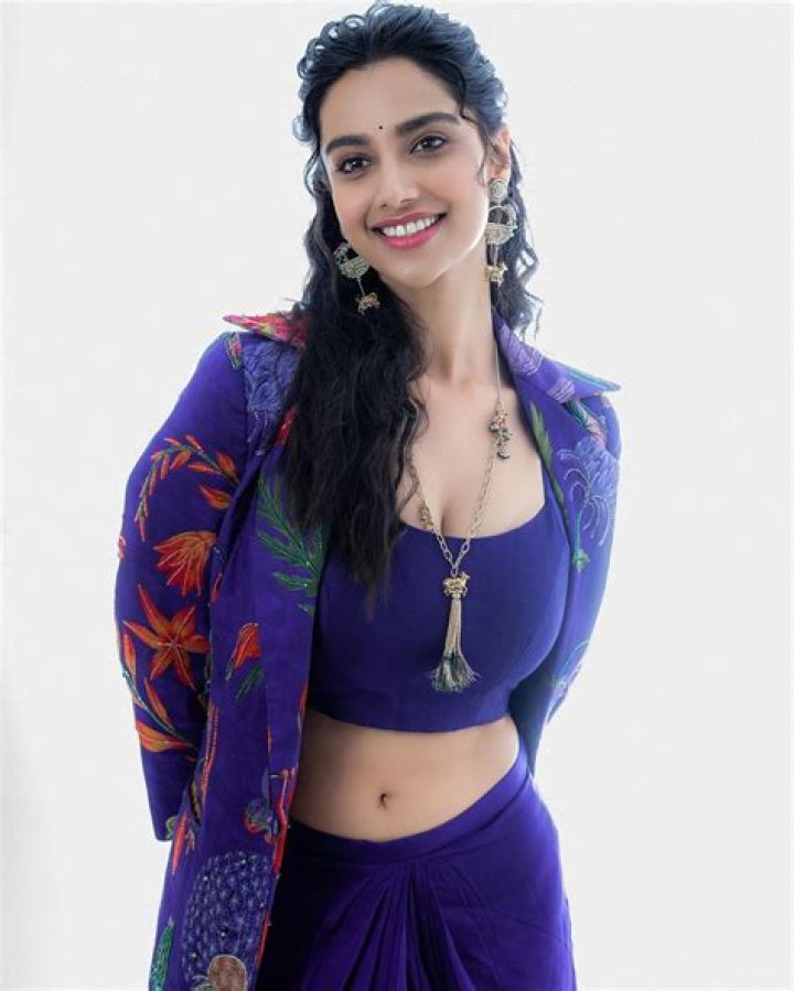 Meenakshi Chaudhary posing for the camera at Times Now 'NRI of the Year' award in July 2018