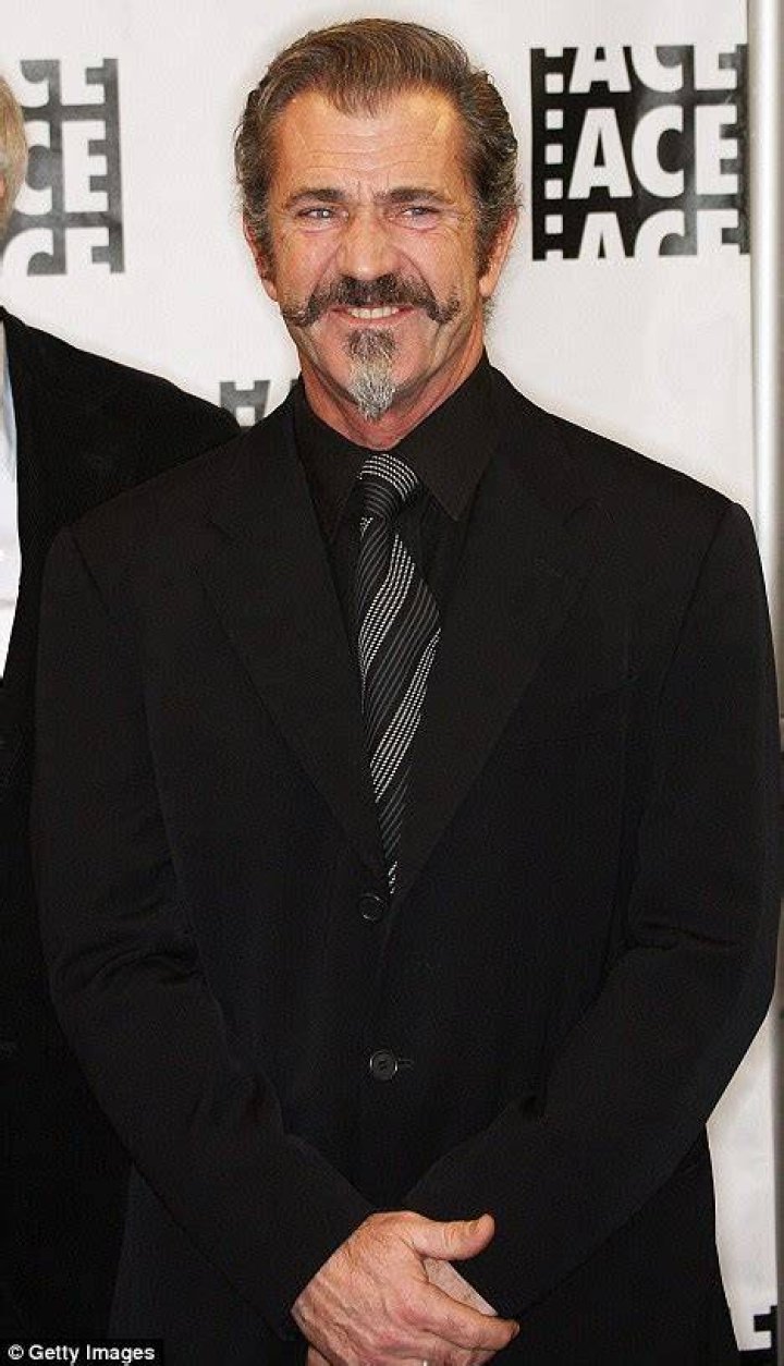 Mel Gibson shows off his buff physique while arriving at the Los Angeles gym in August 2013
