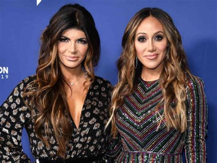 Melissa Gorga and Teresa Giudice at the first fashion show for Envy by Melissa Gorga at Macaluso's in Hawthorne, New Jersey on March 30, 2016