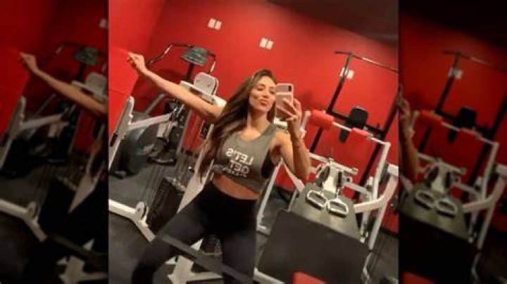 Melissa Gorga working out on an exercise ball