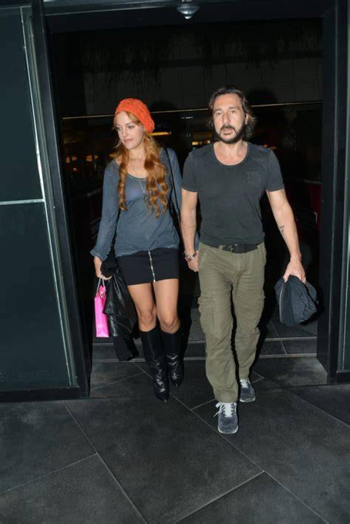 Meryem Uzerli and Can Ateş leaving a restaurant in Istanbul in 2013