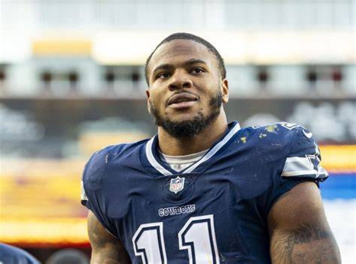 Micah Parsons playing for the Dallas Cowboys in a game against the Washington Football Team at AT&T Stadium on December 26, 2021