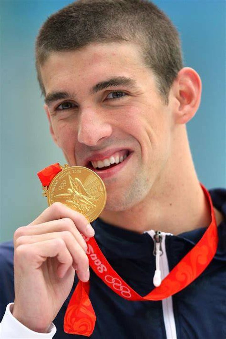 Michael Phelps during a medal ceremony for the Men’s 100 Meter Butterfly competition at the 2016 USA Olympic Team Swimming Testing