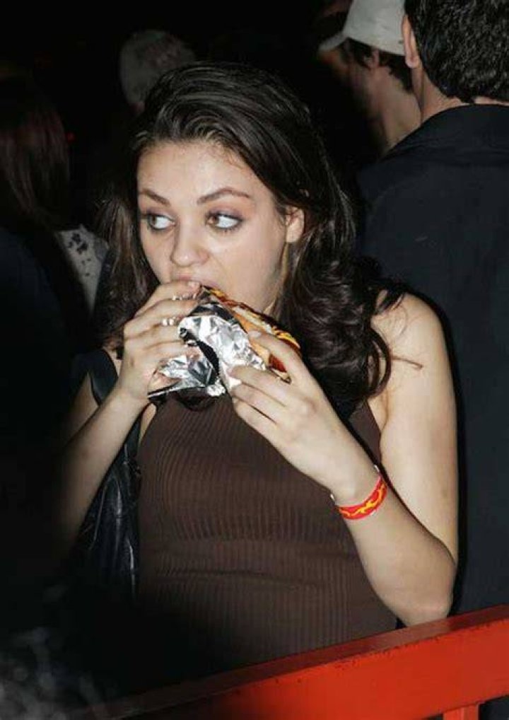 Mila Kunis eating hot dog