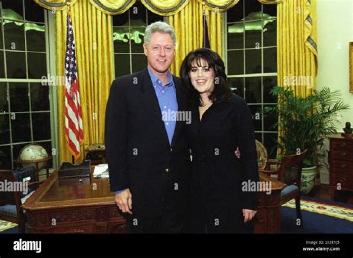 Monica Lewinsky posing with President Bill Clinton in the 1990s