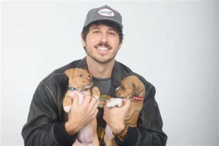 Morgan Evans with his dog as seeh in July 2018