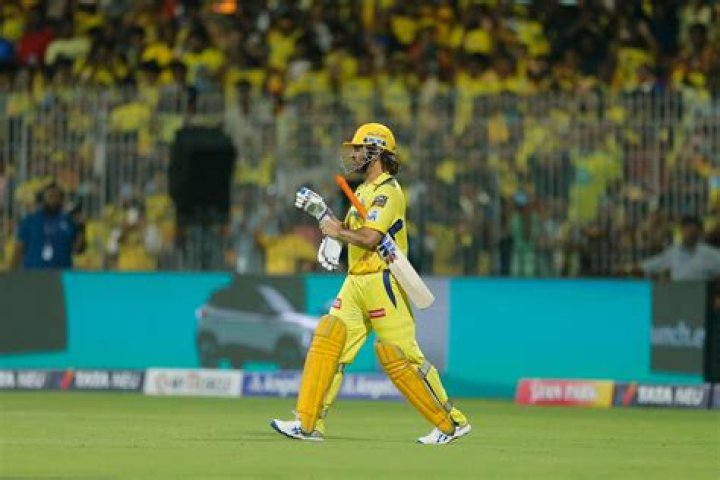 MS Dhoni re-energizing with a drink.