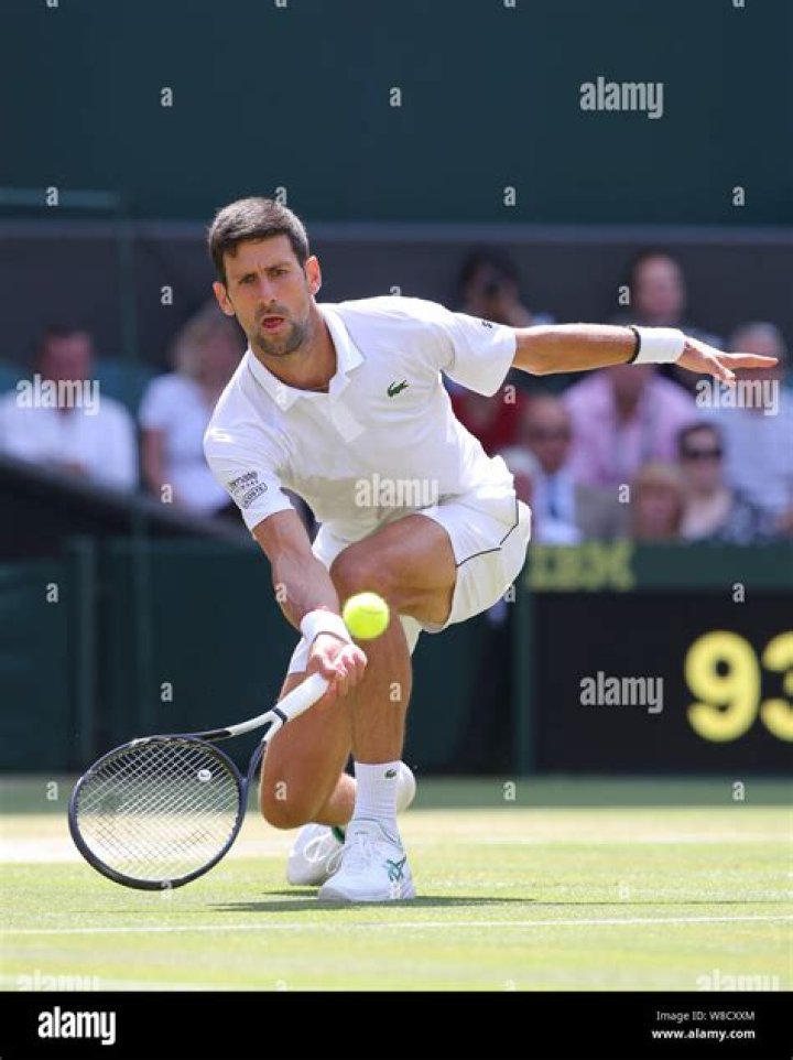 Novak Djokovic playing a shot during a match.